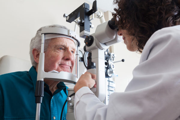 Senior man getting eye exam