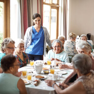 Shot of a group of seniors enjoying breakfast together in their retirement home